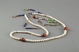 A strand of 108 pearl court beads