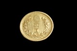 AN ANTIQUE JAPANESE GOLD COIN