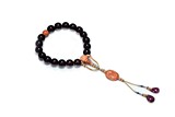 A 'GOLDEN LINE' CHERRY AMBER CORAL ROSARY BRACELET