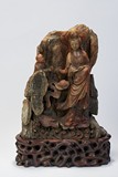 A LARGE SOAPSTONE GUANYIN FIGURAL CARVING WITH INSCRIPTION