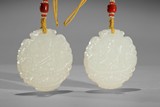 A PAIR OF WHITE JADE 'FOUR PLANTS' PLAQUES