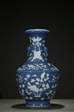 A BLUE AND WHITE RESERVE-DECORATED 'FLOWER' VASE