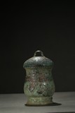 A BRONZE 'TAOTIE' WINE VESSEL AND COVER 