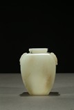 A SMALL WHITE JADE CARVED JAR