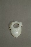 A SMALL WHITE JADE CARVED ORNAMENT
