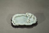A WHITE JADE 'CRABS AND REED' WASHER WITH STAND
