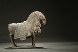 A LIMESTONE CARVED HORSE