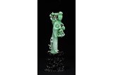 A NATURAL JADEITE FIGURE CARVING OF MAGU