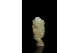 A WHITE JADE CARVING OF BOY WITH LINGZHI