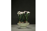 A WHITE JADE PLANTER WITH GREEN JADE ORCHIDS