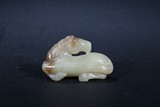A WHITE JADE CARVED HORSE