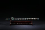 A SILVER AND ENAMELED JADE INSET SWORD