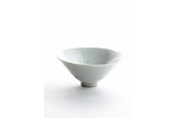 A WHITE GLAZED CONICAL BOWL