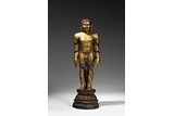 A LARGE GILT LACQUER WOOD FIGURE OF STANDING JINA
