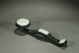 A LARGE SPINACH GREEN AND WHITE JADE RUYI SCEPTER