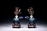 A PAIR OF BLUE GLAZED MYTHICAL BEAST SUPPORTING VASES