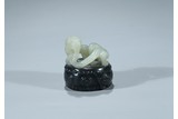 A BLACK AND WHITE JADE 'CHILONG AND DRUM' SEAL