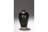 A BLACK GLAZED VASE MEIPING