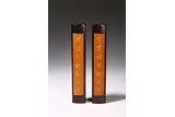 A PAIR OF BAMBOO VENEER 'COUPLET' PAPER WEIGHT