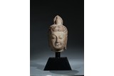 A WHITE MARBLE CARVED HEAD OF BODHISATTVA