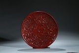 A CARVED CINNABAR LACQUER 'PEONY' DISH