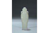 A WHITE JADE CARVED ARCHAISTIC VASE AND COVER