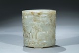 A LARGE WHITE JADE CARVED 'ELEPHANT' CYLINDRICAL BRUSHPOT