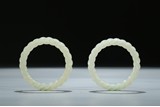 A PAIR OF ROPE-TWISTED WHITE JADE BANGLES