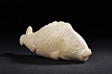 A MARBLE CARVED MODEL OF FISH