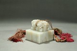 A WHITE JADE CARVED 'DRAGON' SEAL