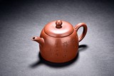 A YIXING RED CLAY 'INSCRIPTION' TEAPOT