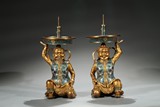 A PAIR OF CHINESE CLOISONNE ENAMEL 'FOREIGNER' CANDLESTICKS