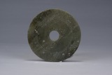 A GREEN JADE CARVED DISC