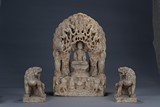 A LARGE MARBLE CARVED BODHISATTVA AND TWO BUDDHIST LIONS