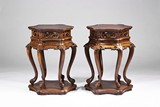 A PAIR OF HARDWOOD CARVED TABLE-FORM STANDS