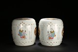 A PAIR OF FAMILLE ROSE 'FIGURES‘ DRUM STOOLS