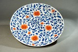 A BLUE AND WHITE UNDERGLAZE RED 'LOTUS' DISH