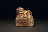 A GILT BRONZE BRONZE SEAL WITH LION-SHAPED TOP