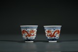 A PAIR OF CHINESE FAMILLE ROSE 'DRAGON' WINE CUPS