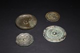 A SET OF FOUR ARCHAIC BRONZE MIRRORS