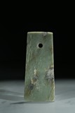 A GREEN JADE CARVED AXE BLADE
