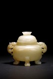 A CHINESE WHITE JADE CARVED TRIPOD CENSER