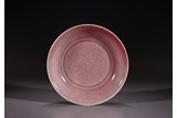 A CHINESE PEACHBLOOM RED GLAZED SAUCER DISH