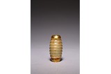 A CHINESE GILT PAINTED ARCHAIC JADE BEAD