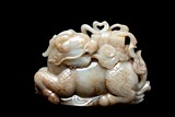 A LARGE JADE CARVING OF QILIN AND BOOK