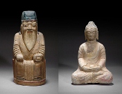 A stone figure and a wooden figure