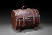 A Chinese wooden trunk with leather straps