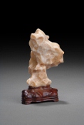 An agate scholar stone on a stand