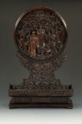 A wood carved table screen