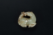 A Chinese carved jade ornament of a monkey and horse